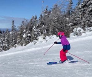 A young girl skiing at Mont-Tremblant in Canada