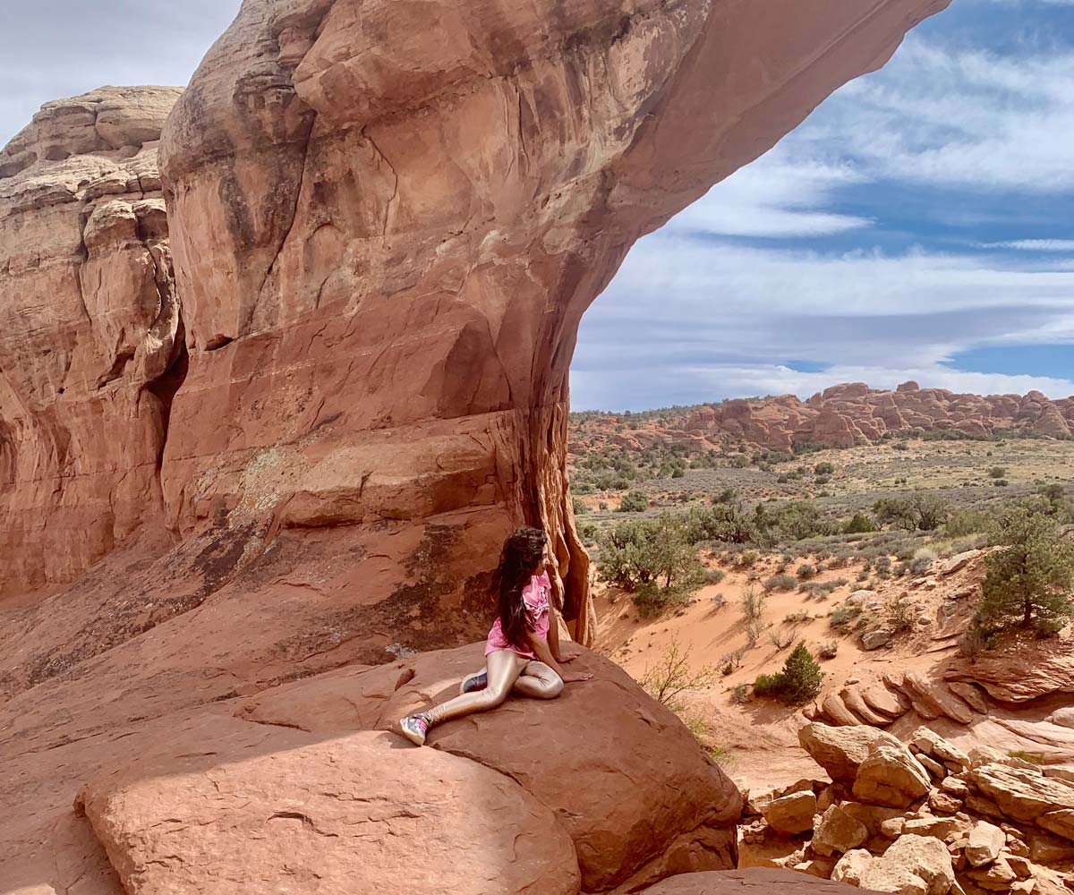 Two hikers in Moab during a spring break trip with kids.