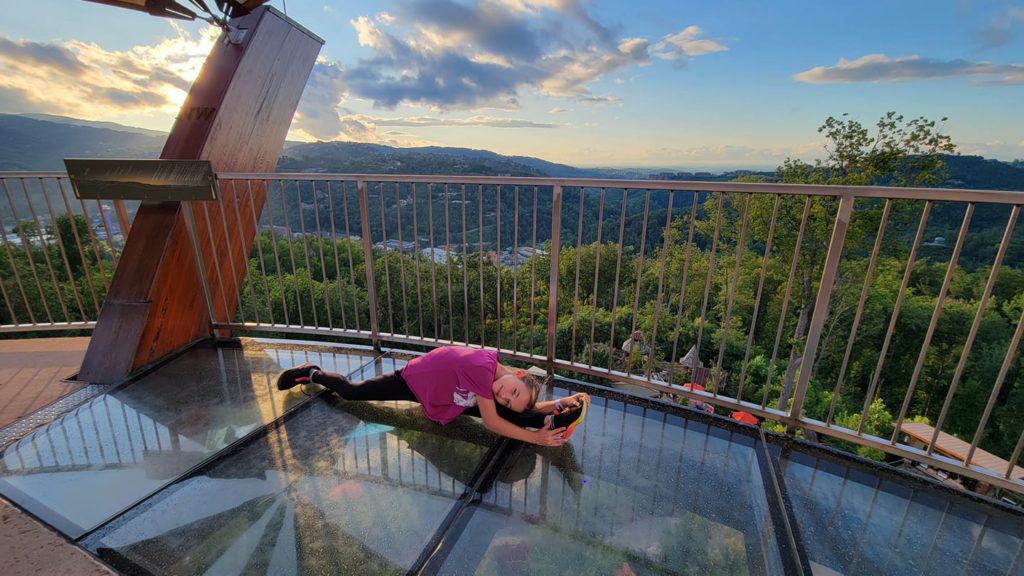 A child doing a split on an observation platform in Great Smoky Mountains National Park.