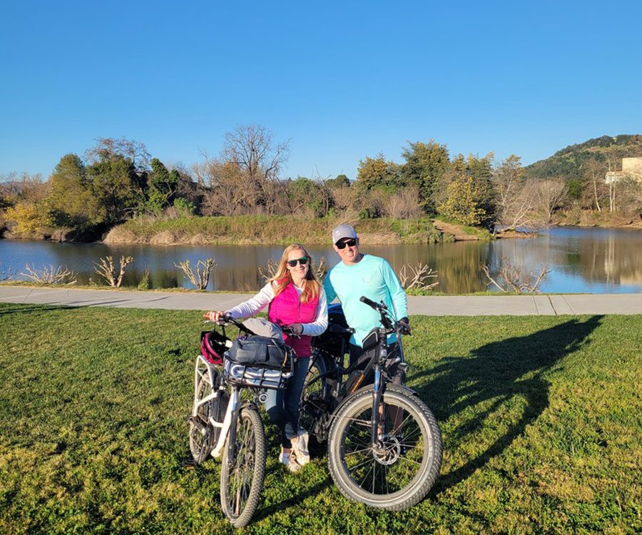 A husband and wife with two bikes in Napa Valley.