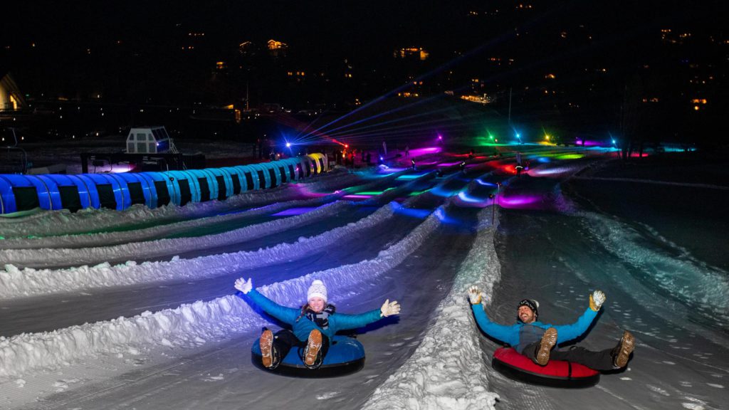 Disco tubing at Palisades Tahoe, one of the best places to go snow tubing in Lake Tahoe with kids. 