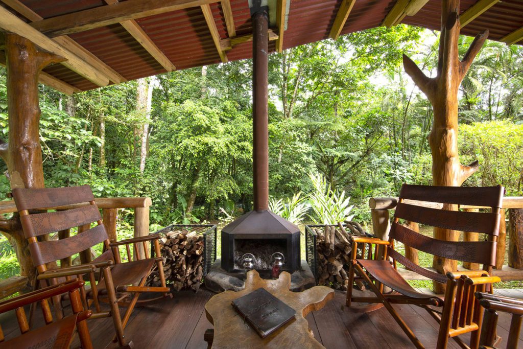 An outdoor dining area with a wood burning stove at La Carolina Lodge. 