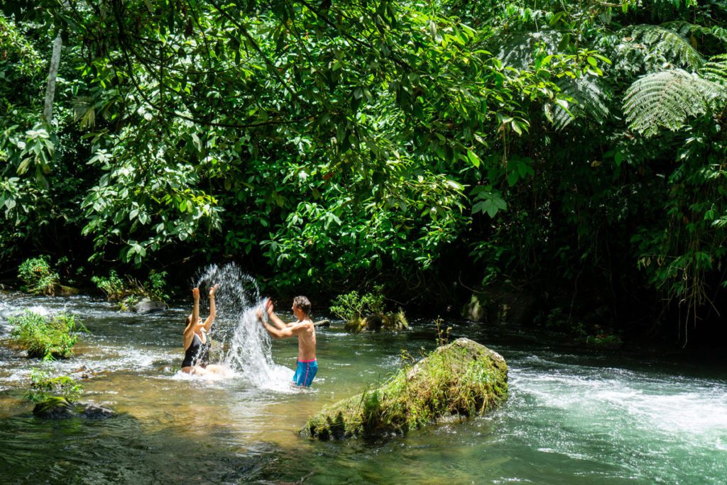 Two kids playing in the water at La Carolina Lodge in Costa Rica.