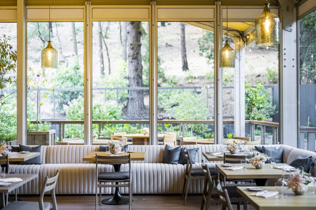 A view of the indoor dining area at Meadowood Napa Valley, one of the best hotels In Napa Valley for a romantic getaway or girls' weekend.