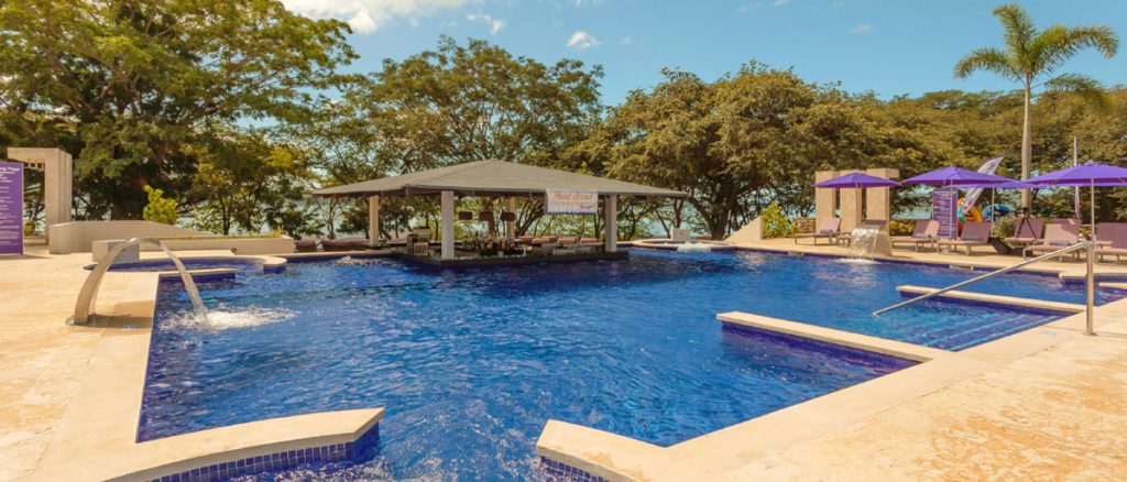 The outdoor pool area at Planet Hollywood Costa Rica, one of the best all-inclusive resorts in Costa Rica for families. 