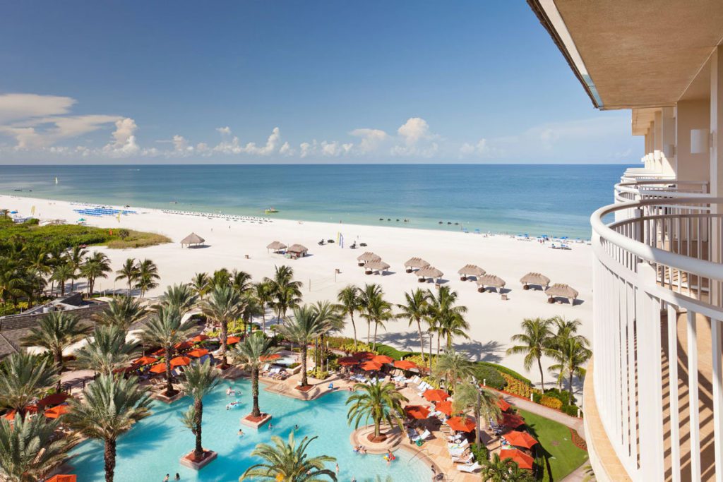 An aerial view of the beach and pool area at the JW Marriott Marco Island Beach Resort and Spa, one of the best Marriott hotels in Florida for families. 