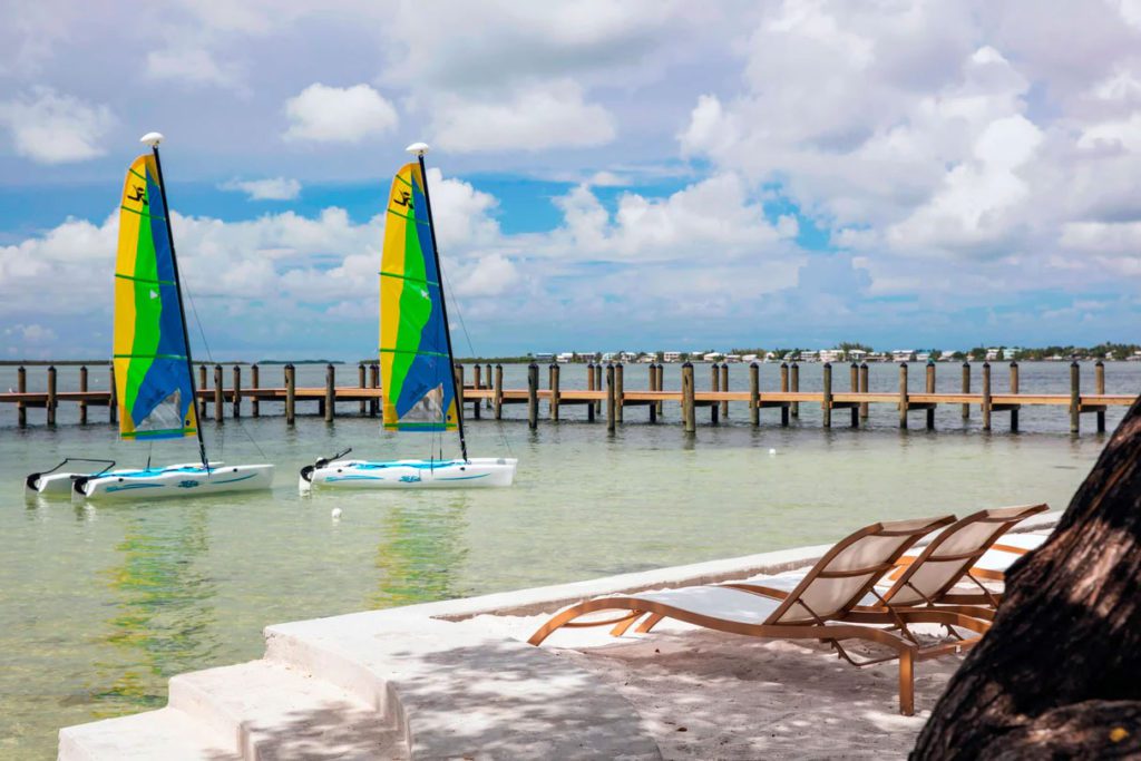 Two sailboats in the water by Playa Largo Resort and Spa, one of the best Marriott hotels in Florida for families.