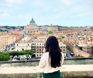 A young girl overlooking Rome.