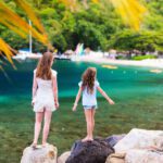 Two kids overlooking the turquoise waters of St. Lucia.